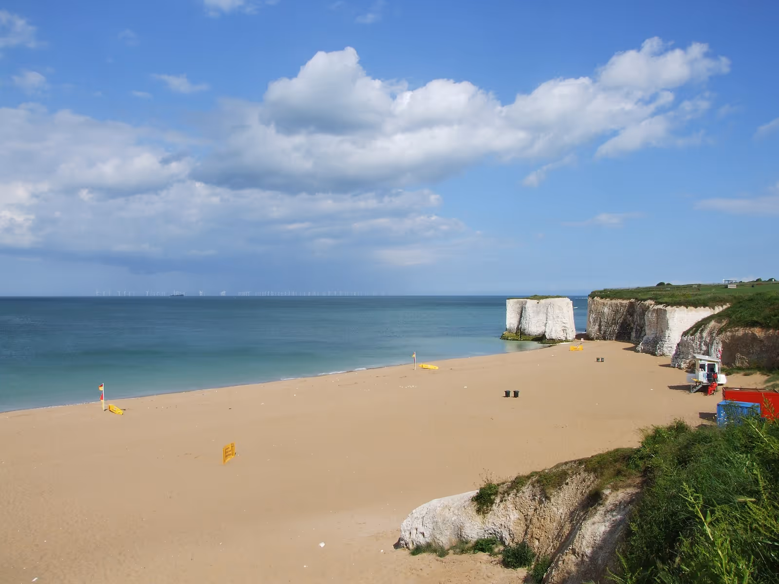 Botany Bay beach and chalk cliffs at low tide, looking along the sand