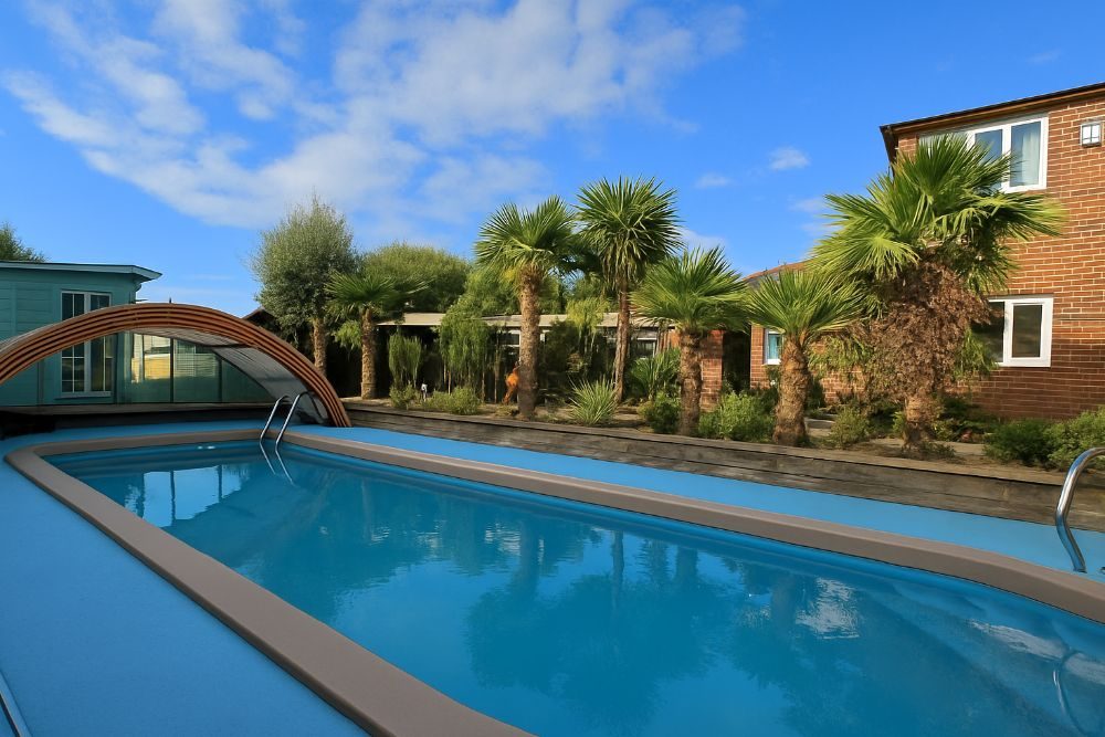 Heated salt-water swimming pool with retractable enclosure at Botany Bay Beach House, Kingsgate