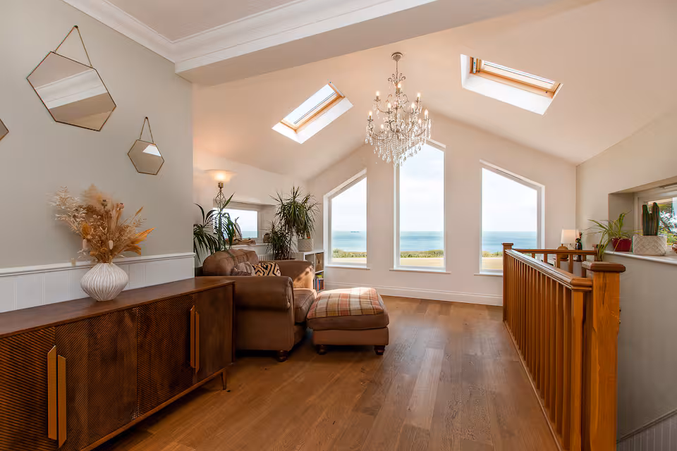 Upper landing with chandelier, skylights and panoramic Channel views